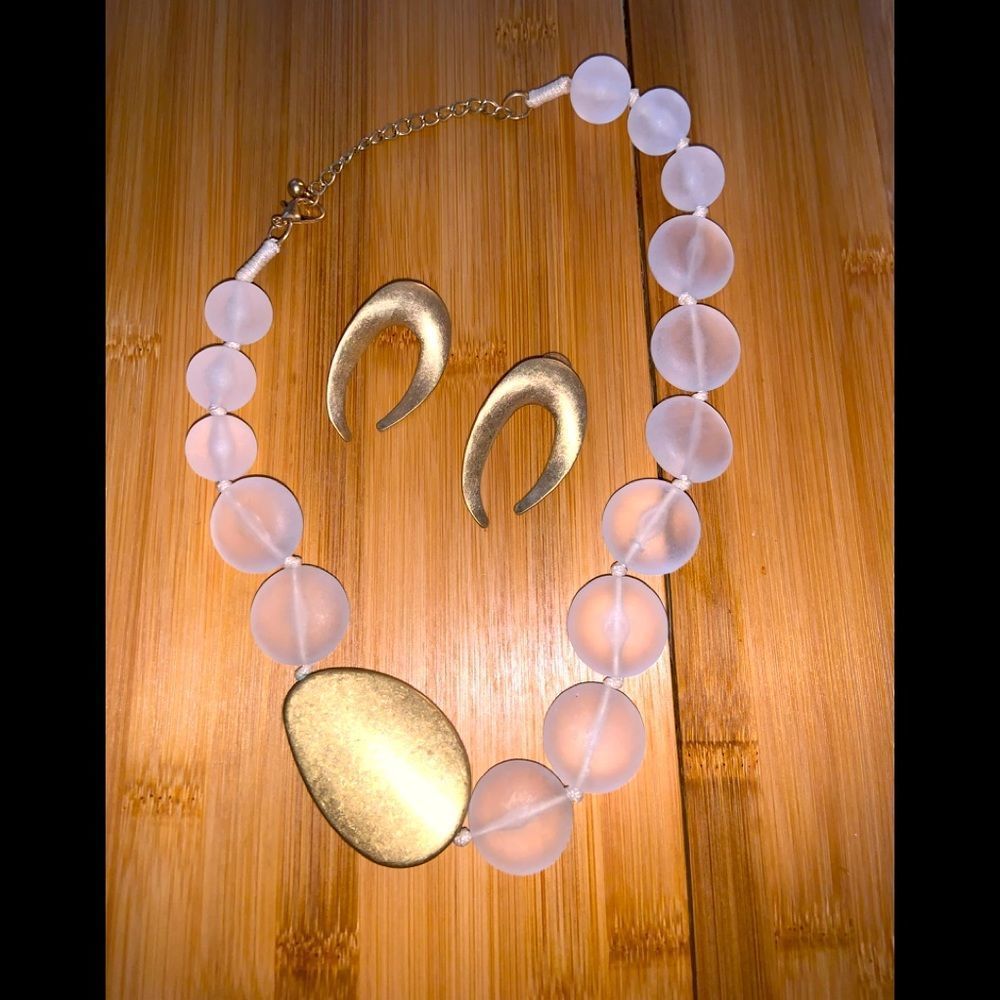 Fashion jewelry set with gold tone earrings and accent, large clear beads